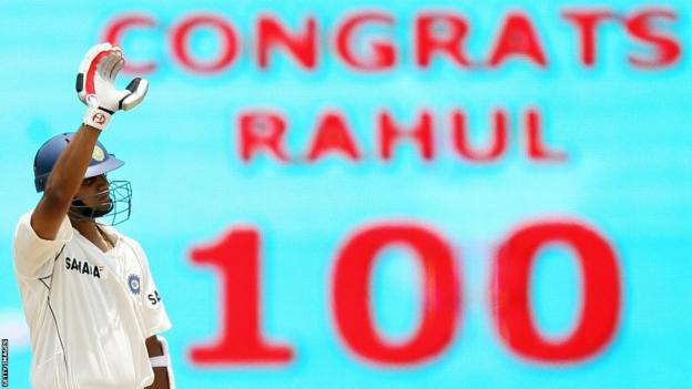 Rahul Dravid acknowledges a message on a screen congratulating him for reaching 100 against South Africa