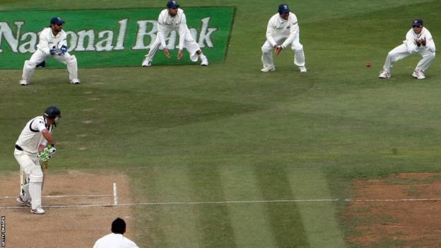 Rahul Dravid (top right) catches Tim McIntosh in Wellington, New Zealand