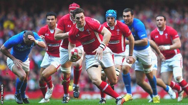 Wing George North launches a Wales atttack against Italy