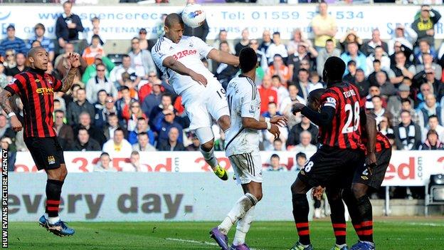 Luke Moore scores Swansea City's winner against Manchester City