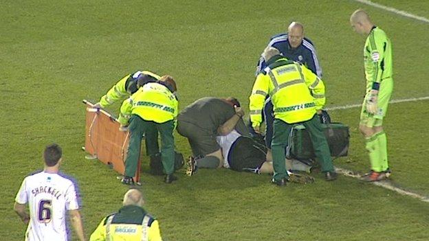 Derby County's Shaun Barker is treated after suffering a serious knee injury in the game against Nottingham Forest