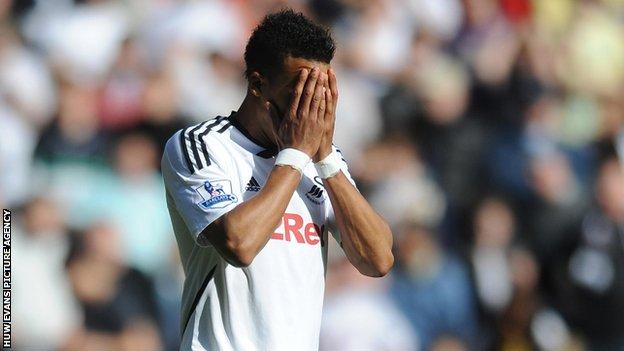 Scott Sinclair shows his disappointment after missing a penalty against Manchester City