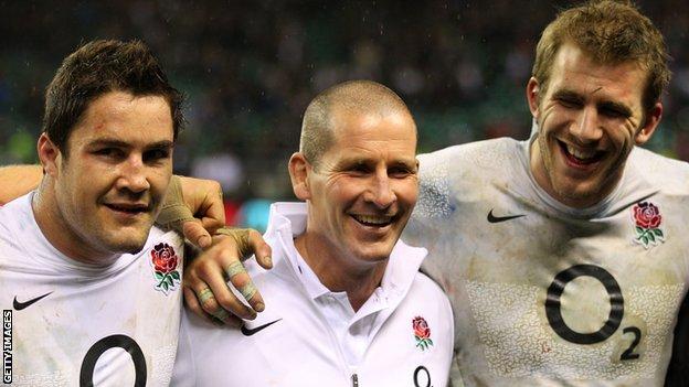 England interim coach Stuart Lancaster (centre) celebrates win over Ireland