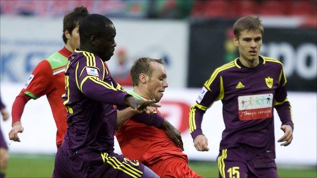 Purple-clad Chris Samba (left) in action against Lokomotiv Moscow
