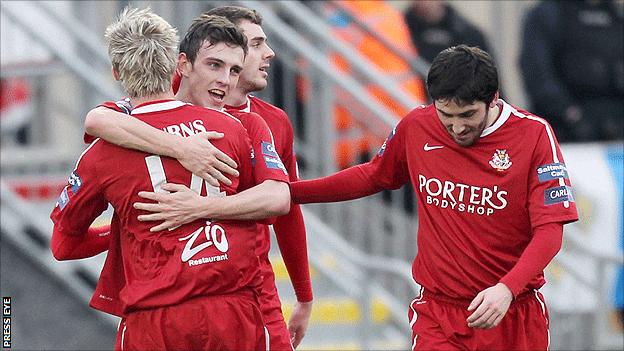 Conor McCluskey celebrates with team-mates after giving Portadown the lead