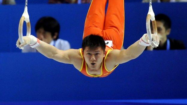 Yibing Chen performing on the rings