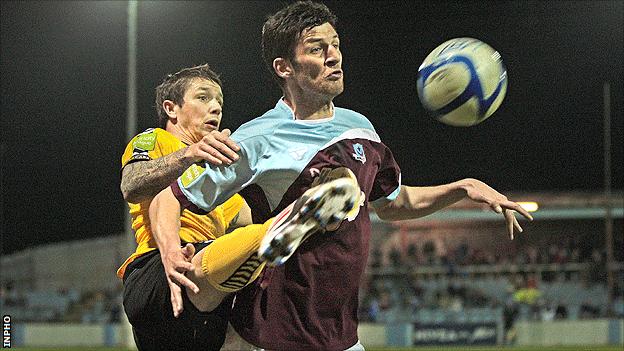 Rory Patterson of Derry City in action against Drogheda's Gavin Brennan