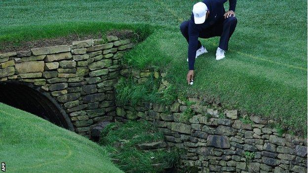Tiger Woods in a spot of bother on the 13th hole