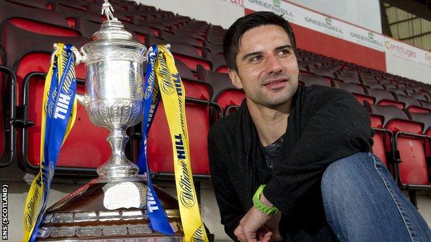 Aberdeen striker Rory Fallon poses with the Scottish Cup