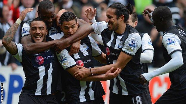 Newcastle United players celebrate against Bolton Wanderers