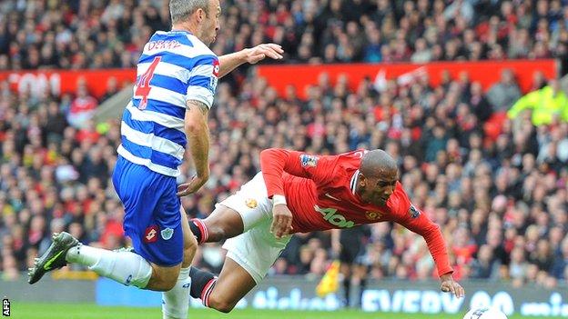 Shaun Derry (left) collides with Manchester United's Ashley Young