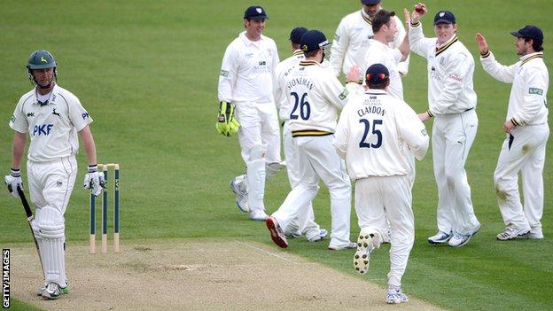 Durham celebrate the wicket of Neil Edwards