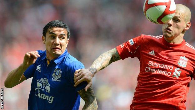 Everton's Tim Cahill (l) and Liverpool defender Martin Skrtel in action during the FA Cup semi-final at Wembley