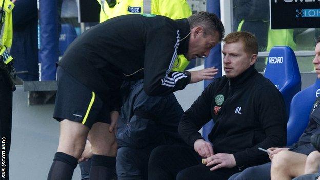 Fourth official Iain Brines (left) has words with Celtic manager Neil Lennon