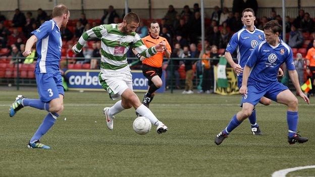 Greg Draper takes on Bangor City's defence