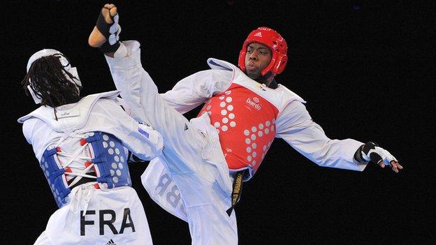 Lutalo Muhammad competes against France's Augustin Bata during the men's -87kg final at the 2012 European Taekwondo Championships in Manchester