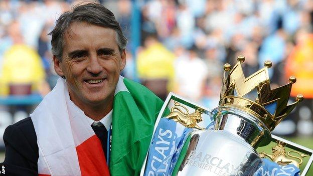 Manchester City manager Roberto Mancini with the Premier League trophy
