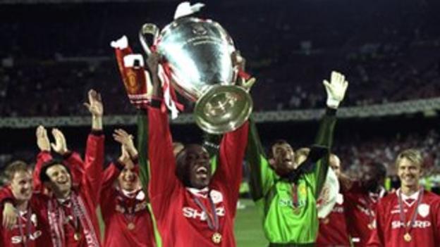 Dwight Yorke lifts the European Champions League in 1999