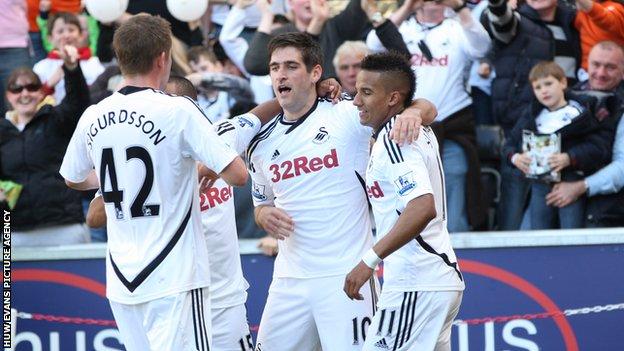 Danny Graham (centre) celebrates his winning goal against Liverpool in the final game of the season