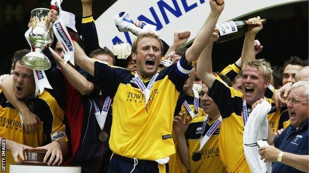 Mark Yates lifts the play-off trophy in 2002