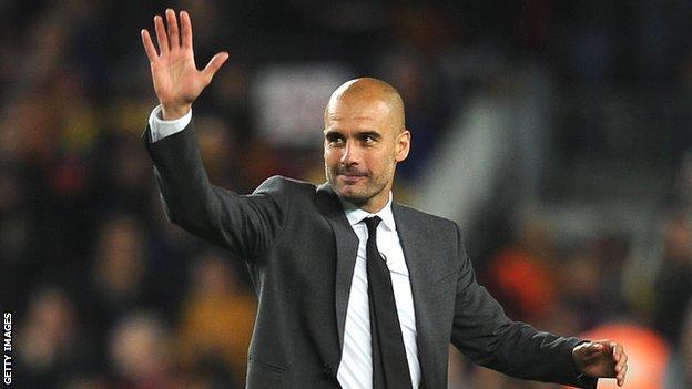 Pep Guardiola waves to the Barcelona fans