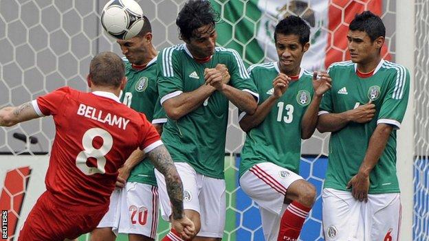 Wales' Craig Bellamy has a shot on goal against Mexico