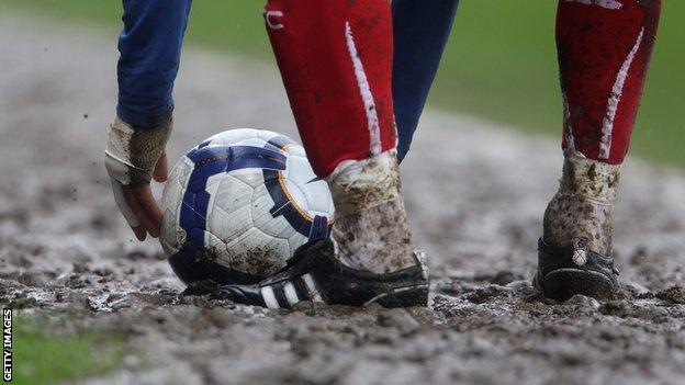 A muddy football pitch