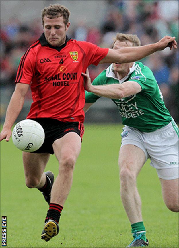 Down's Darren O'Hagan in action against Tommy McElroy of Fermanagh