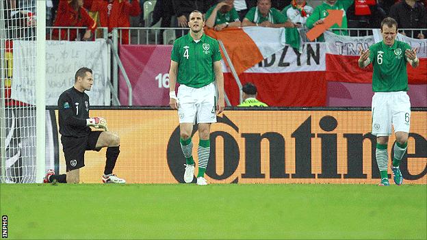 Shay Given, John O'Shea and Glenn Whelan show their disappointment after conceding an early goal against Spain