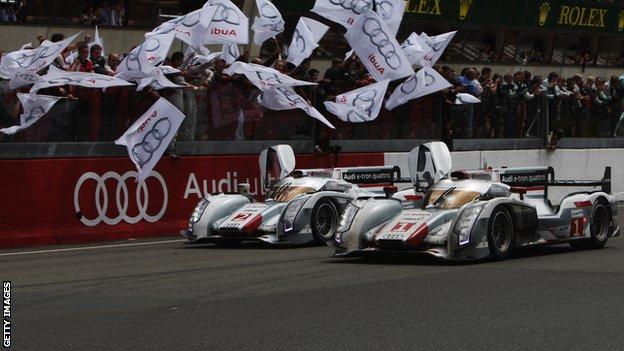 The two Audo e-tron Quattro hybrids are greeted by their fans after finishing first and second
