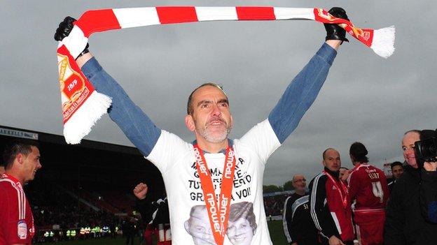 Swindon manager Paolo Di Canio celebrates winning the League Two title