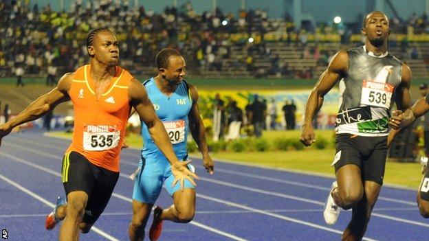 Yohan Blake (left) celebrates after crossing the finish line ahead of current world-record holder Usain Bolt (right)