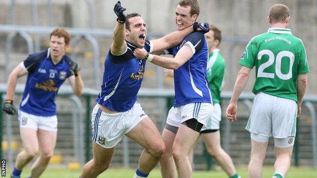 Eugene Keating celebrates with Niall Smith after scoring Cavan's third goal against Fermanagh