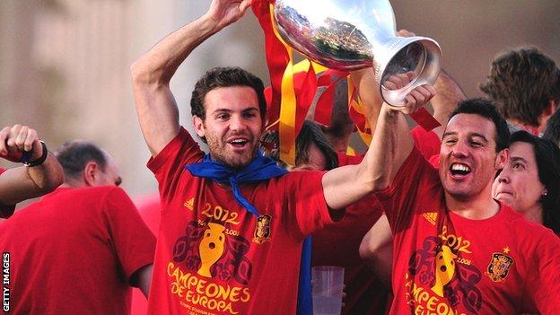 Juan Mata (right) lifts the Henri Delaunay trophy