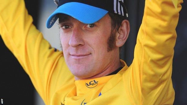 Bradley Wiggins dons the yellow jersey after stage seven