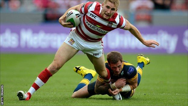Wigan's Sam Tomkins is tackled by Zak Hardaker of Leeds during Saturday's Challenge Cup semi-final