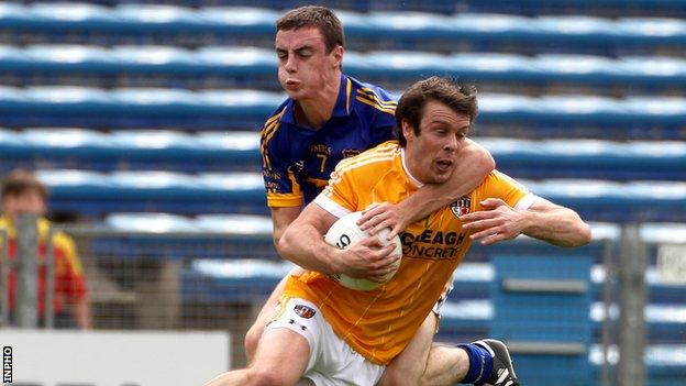 Tipperary's Alan Campbell challenges James Loughrey