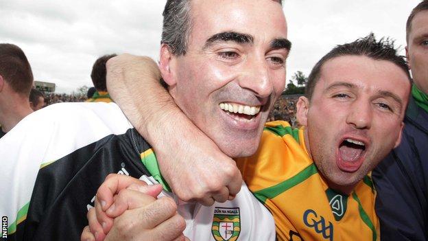 Jim McGuinness is embraced by Donegal fans after the county's Ulster Final triumph