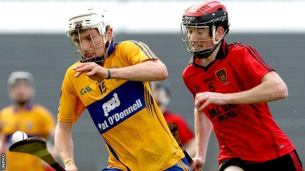 Clare's Shane O'Donnell tries to burst away from Down's Ryan Brannigan