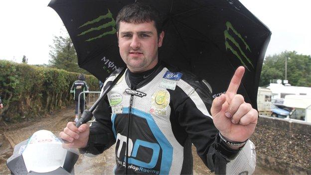 Michael Dunlop celebrates his victories at a rainy Armoy