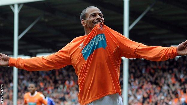 DJ Campbell celebrates scoring a goal for Blackpool in 2011
