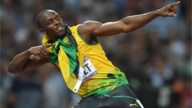 Usain Bolt celebrates his double sprint gold