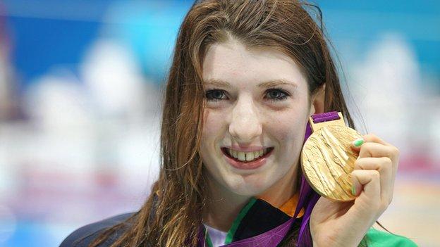 Bethany Firth celebrates with her gold medal
