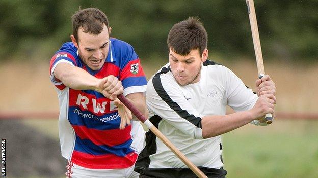 Lee Bain of Kingussie in action with Lovat's Greg Matheson in the Orion Premiership at The Dell