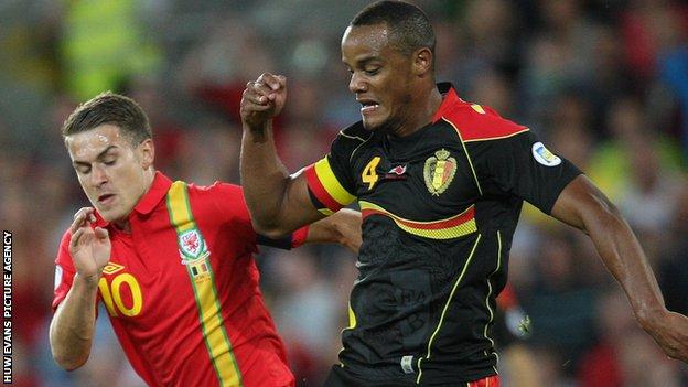 Wales captain Aaron Ramsey challenges Belgium captain Vincent Kompany