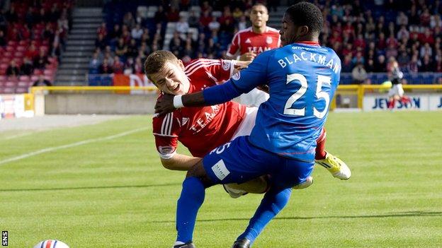 Blackman fouls Aberdeen winger Ryan Fraser in the early moments of the defender's debut
