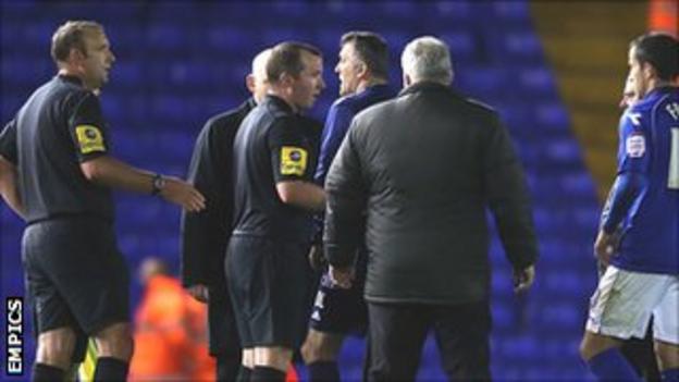 Bolton Wanderers manager Owen Coyle confronts the officials following the 2-1 defeat at Birmingham