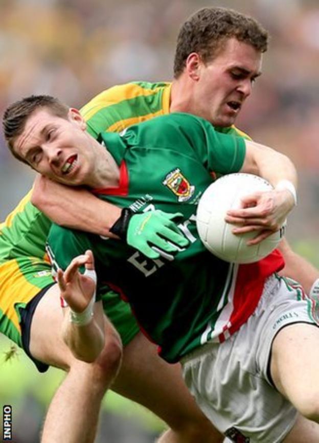 Enda Varley of Mayo is challenged by Donegal's Eamon McGee during the All-Ireland final