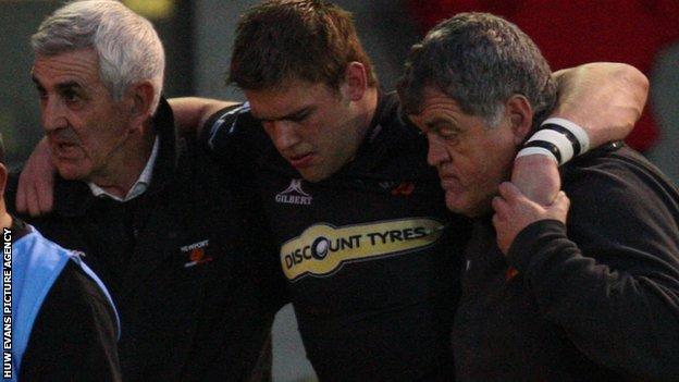 Dan Lydiate is helped off the field