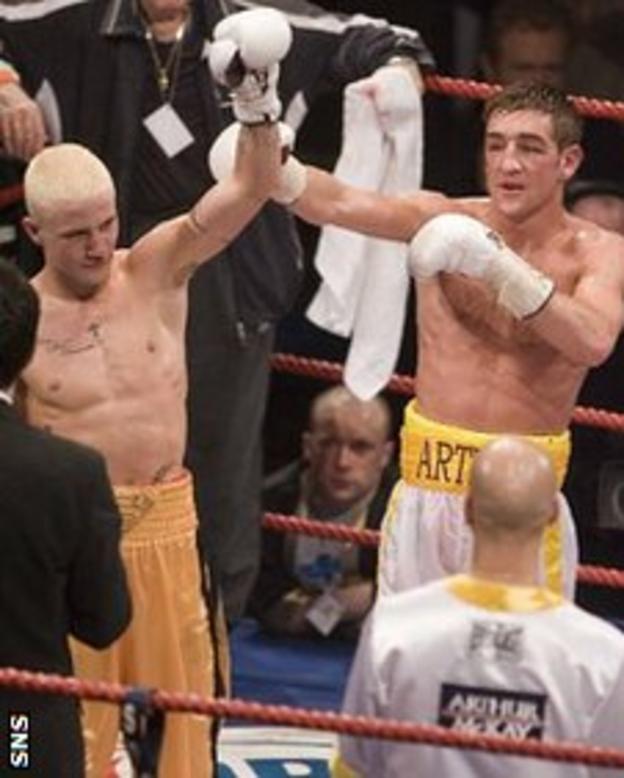Alex Arthur raises Ricky Burns's arm after he had beaten the Coatbridge fighter in 2006